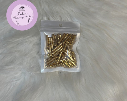 Packaged gold screws on a gray fur background with a brand label.