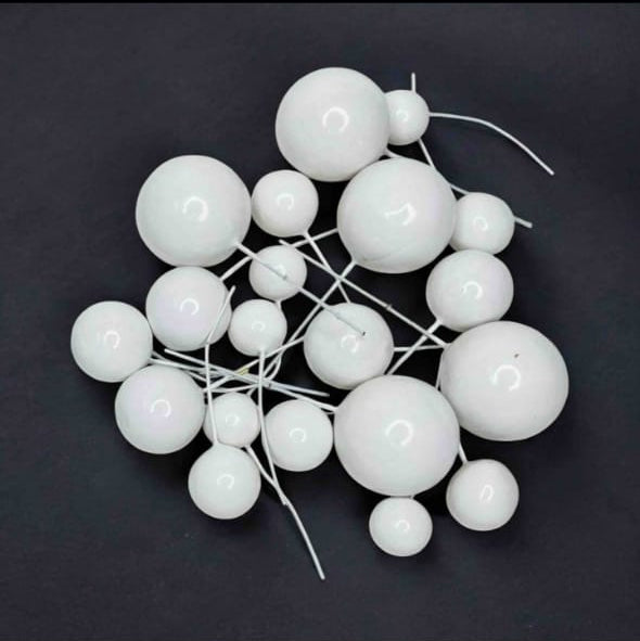 Decorative white spherical object on a dark background