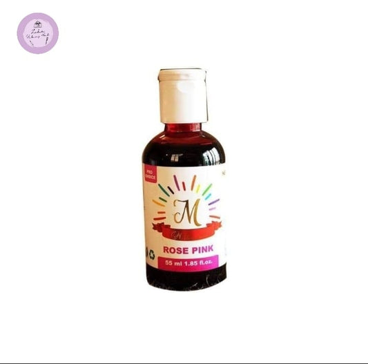 Bottle of rose pink liquid with a colorful label on a white background